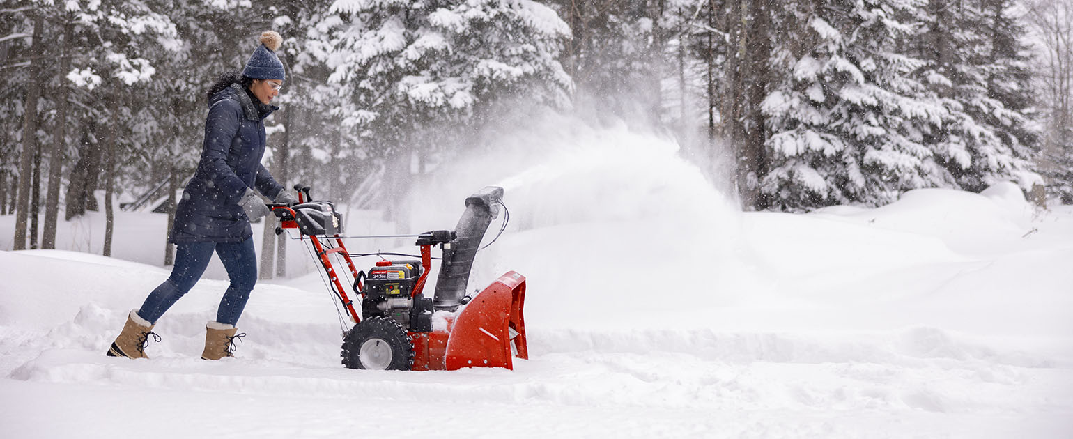snow blower models lined up outside of building