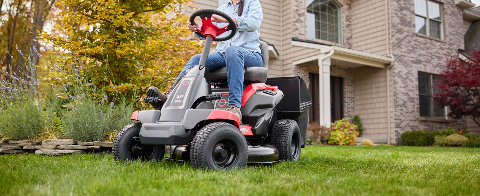 woman riding new electric mini riding mower