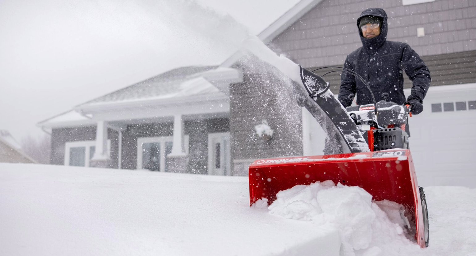 person with snow blower