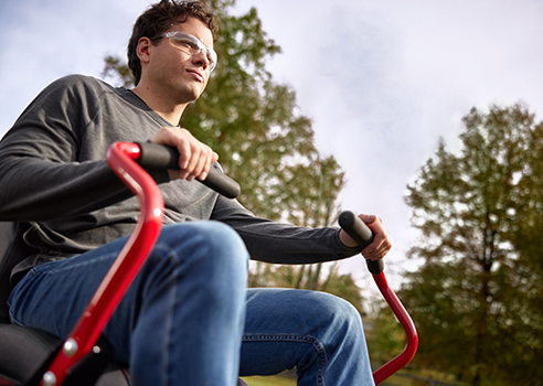 man riding electric zero-turn with little noise