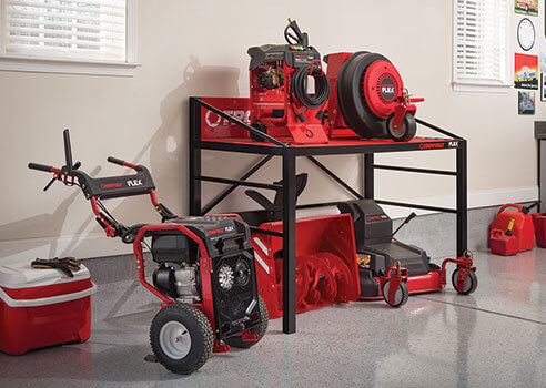 Troy-Bilt FLEX base and attachments in garage